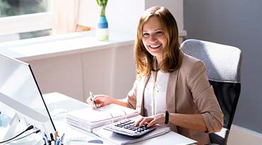 Photo of a young woman doing bookkeeping