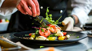 Closeup photo of gourmet food plate being prepared