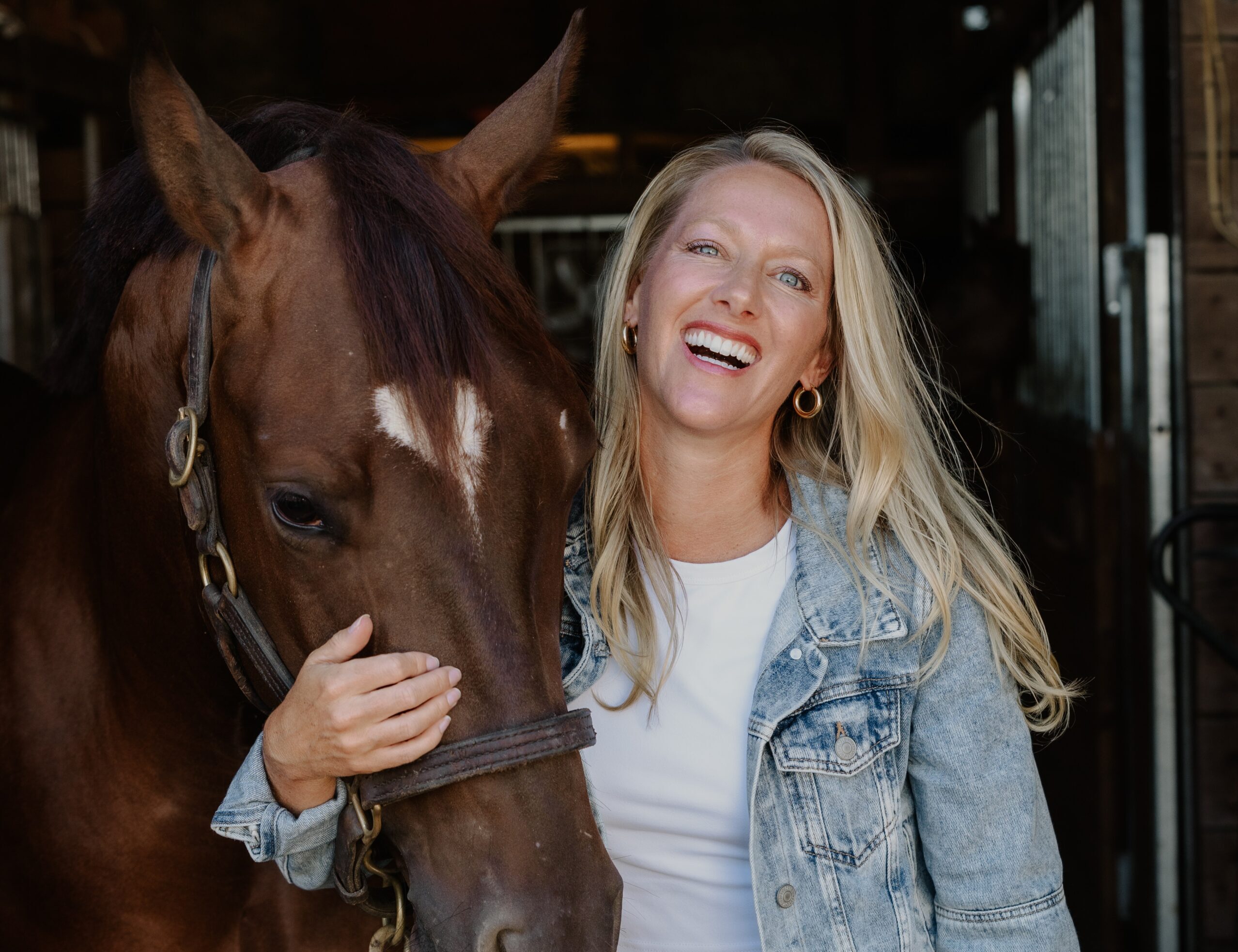 Cassie Brungarth in horse stable